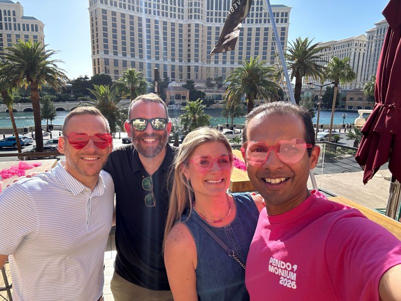Four Balboa teammates in heart-shaped sunglasses on a sunny terrace in Las Vegas